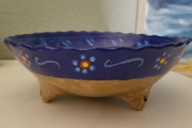 Clay bowl. Dark blue with flowers.