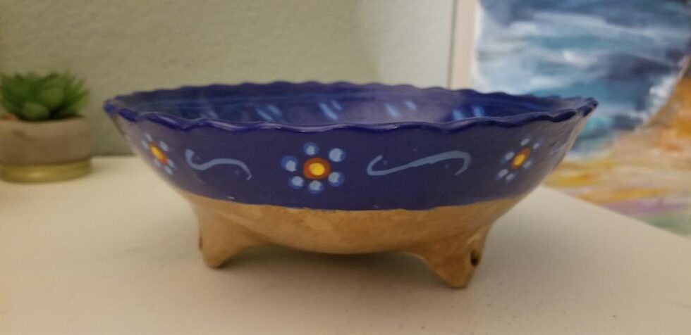 Clay bowl. Dark blue with flowers.